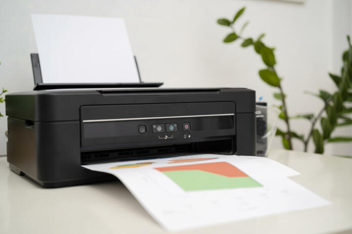 Printer, copier, scanner, workplace. Small printer for use and printing at home, filled with only black paint.