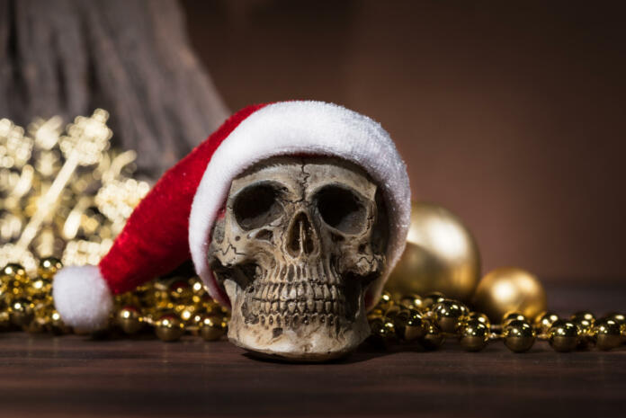 Still life with santa claus skull with gold christmas balls and golden ornament with copy space, Merry xmas and Happy new year concept