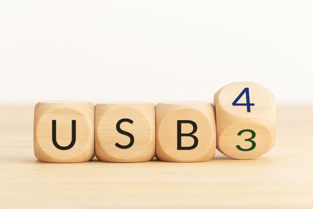 USB 3 to USB 4 change concept. Flip Wooden blocks with text. Copy space