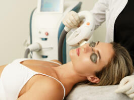 Woman client during IPL treatment in a cosmetology medical clinic