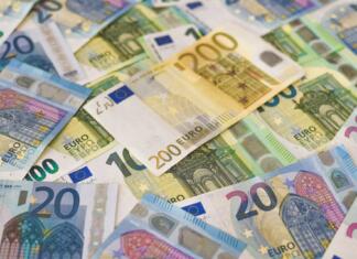 Kam bodo šli naši davki v letu 2023? A pile of Euro (EUR) banknotes that include 20, 100, and 200 notes. (Part IV)