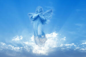 Angel over bright sky background concept of Religion