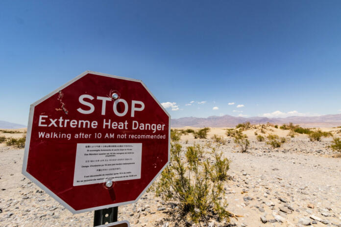 Death Valley USA. Advisory sign not so walk too far. Temperatures on that day were around 50C/122F