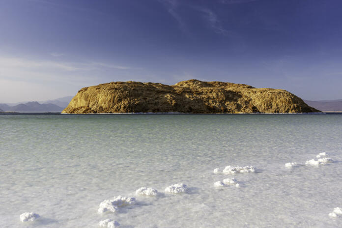 Island in Lake Assal surrounded by white salt crystals, Djibouti, East Africa. Horn of Africa