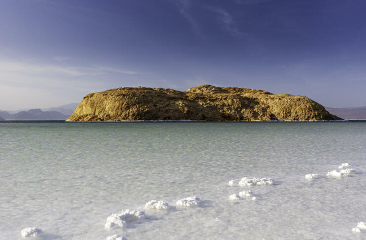 Island in Lake Assal surrounded by white salt crystals, Djibouti, East Africa. Horn of Africa