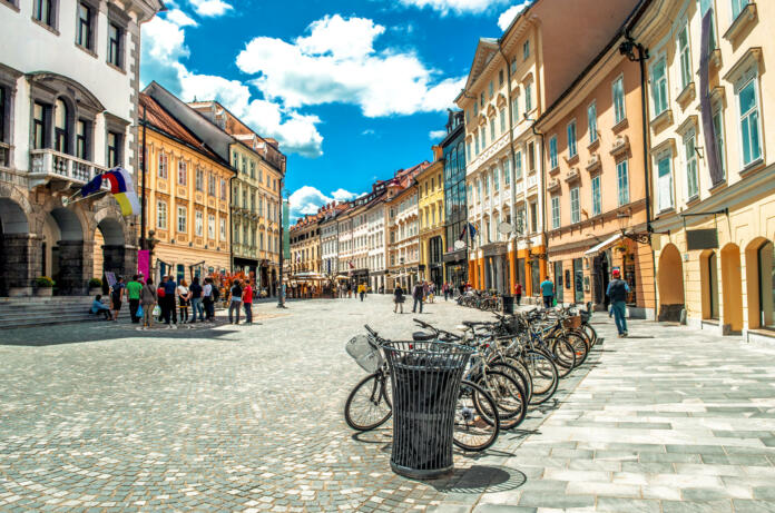 Ljubljana, Slovenia, 03/06/2013 : bycicles parked on a colorful and clean street in the historic distric of the Slovenian capital during summer