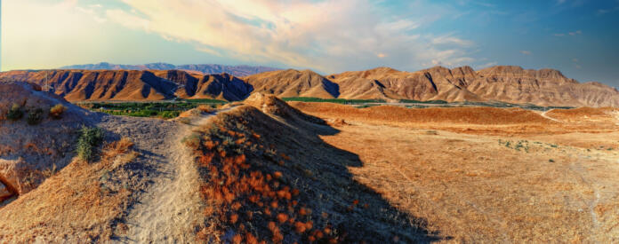 Panoramic view to the Kopet Dag Mountains by the ruins of old silky road center Nisa in the Karakum Desert, Near the border with Iran, Turkmenistan.