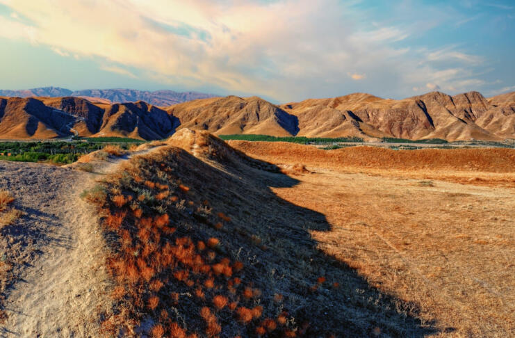 Panoramic view to the Kopet Dag Mountains by the ruins of old silky road center Nisa in the Karakum Desert, Near the border with Iran, Turkmenistan.