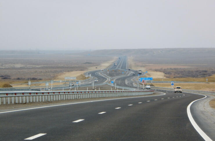 Traffic on the motorway. Cavity Karagiye. Mangistau region. Kazakhstan.