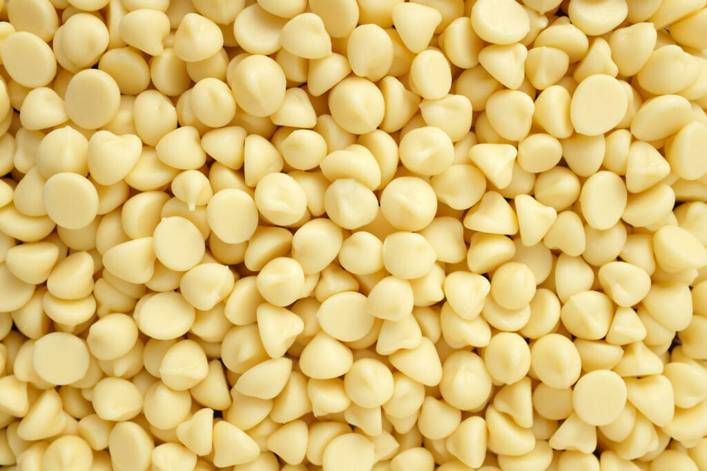 White chocolate chips as an abstract background texture