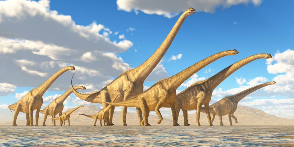 A herd of Sauroposeidon dinosaurs travel together in search of water and vegetation to eat.