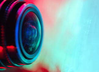 Festival dokumentarnega filma 2021 Camera lens with with multi-colored backlight. Optics