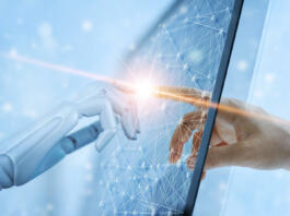 Hands of robot and human touching on global virtual network connection future interface. Artificial intelligence technology concept.