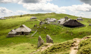 Mountain cottage hut or house on idyllic hill Velika Planina. Bio Eco farming healthy life on Mala Planina or Velika Planina. Travel destination for family hiking.