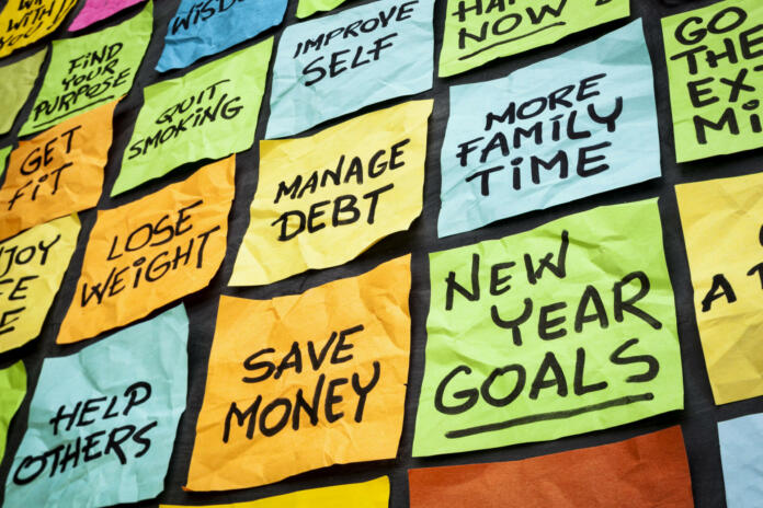 new year goals or resolutions - colorful sticky notes on a blackboard