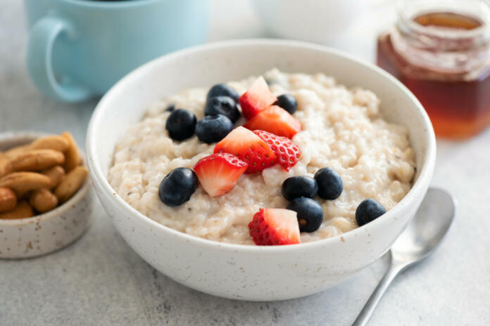 Porridge Bowl With Fresh Summer Berries In Bowl. Clean Eating Dieting Concept. Oatmeal With Berries