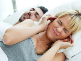 Portrait of woman who can not sleep because her husband snores.