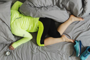 The concept the woman is too lazy to Wake up in the morning for training. Sport concept.