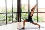 Yoga men workout in studio, training in front of a window