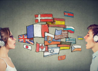 Ljubljanska fakulteta se lahko pohvali z Zvočno knjižnico Young woman and man in headphones learning different languages communicating through simultaneous interpretation