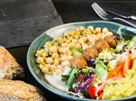 a plate of food with bread and salad