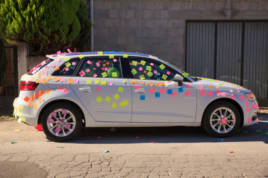 Cacabelos, Spain - August, 07: A white car is covered in post-it notes on August 07, 2016
