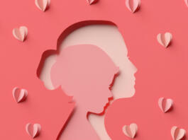 Child inside mom silhouette and some hearts in papercut style. Happy Mother's Day elegant greeting card background in 3D rendering.