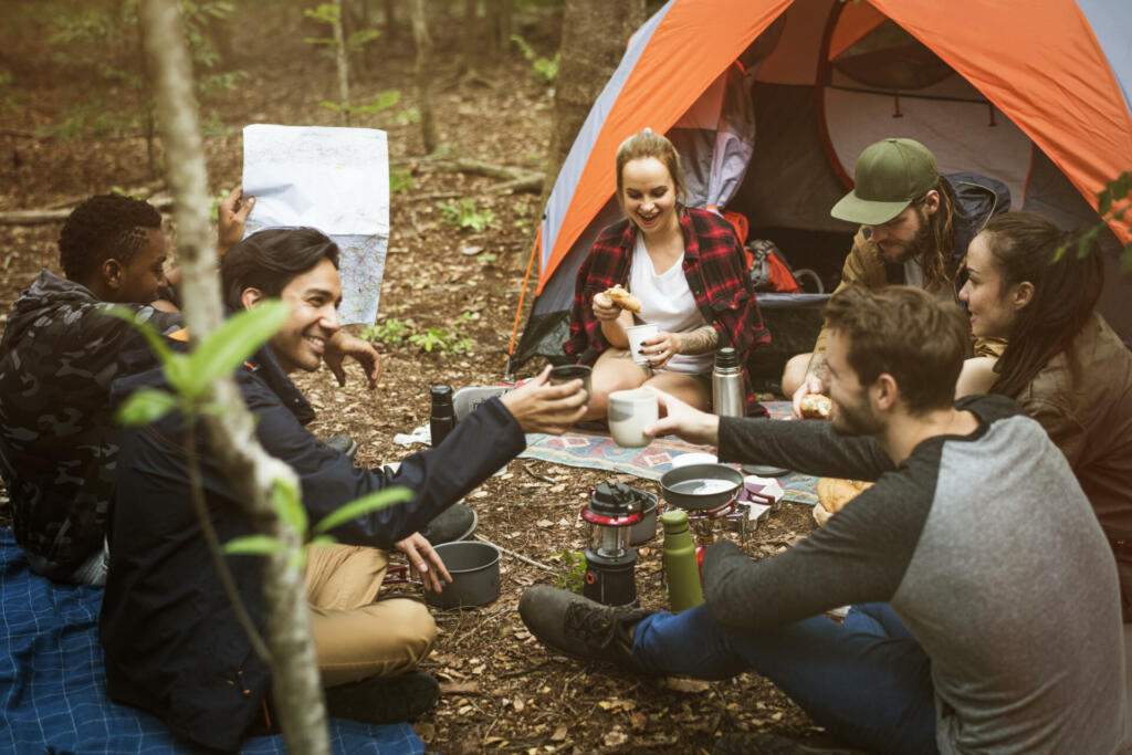 Friends camping in the forest together