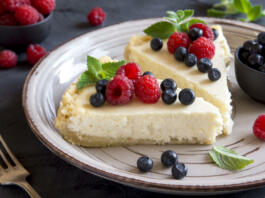Homemade cheesecake with fresh berries and mint for dessert
