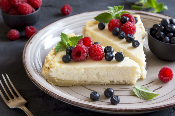 Homemade cheesecake with fresh berries and mint for dessert