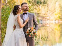 man in gray suit and woman in white wedding dress