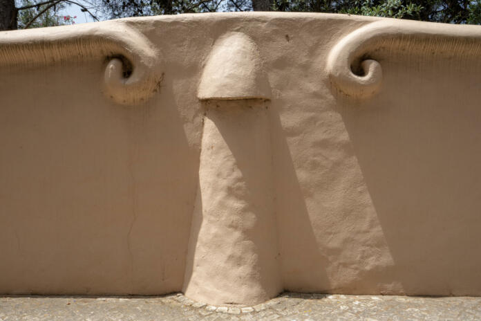 part of concrete wall with relief looking like a human penis.