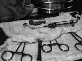 Surgical instruments covered with gauze. Lying on the table in the operating room