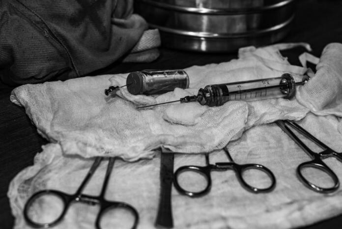 Surgical instruments covered with gauze. Lying on the table in the operating room