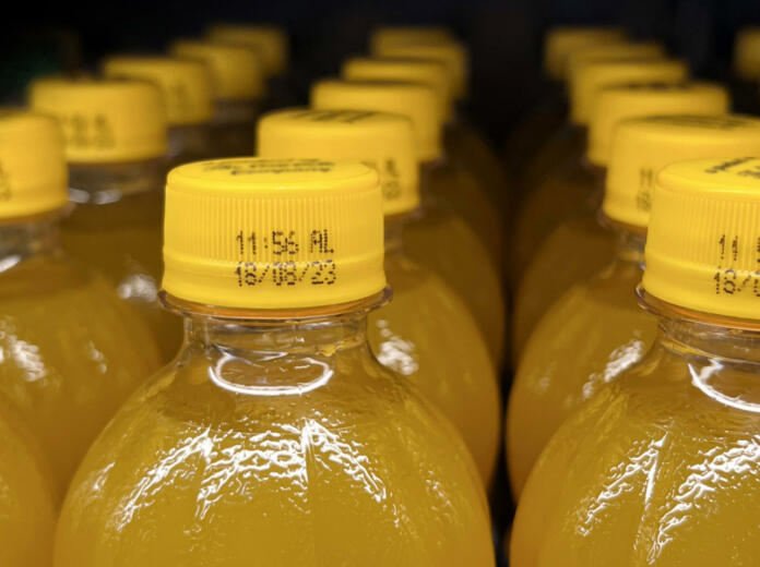 Bottles of orange juice with expiry date
