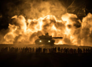 5 vojnih dokumentarnih filmov, ki jih je vredno videti Creative artwork decoration - Russian war in Ukraine concept. Crowd looking on giant explosion and attacking armored vehicles. Selective focus