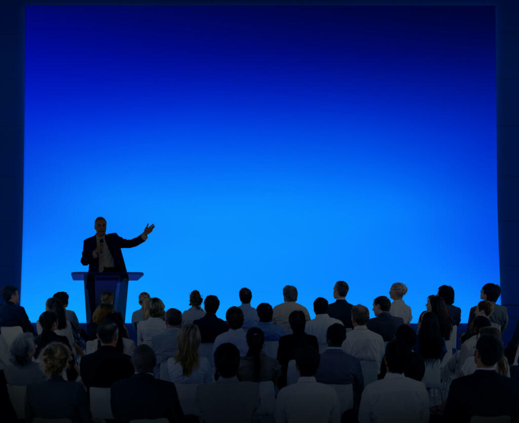 Group Of Business People Listening To A Speech