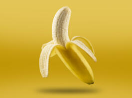 Ripe bananas isolated on yellow background.