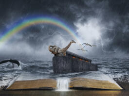 An open Bible with the story of Noahâs ark.