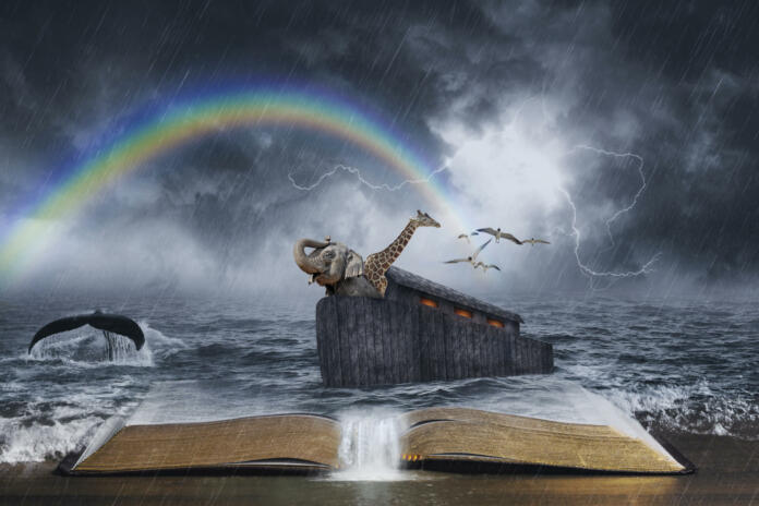 An open Bible with the story of Noahâs ark.