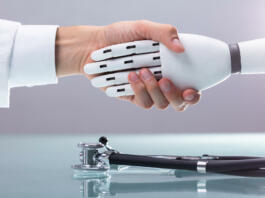 Doctor And Robot Shaking Hands Over Stethoscope