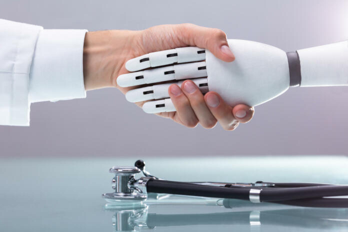 Doctor And Robot Shaking Hands Over Stethoscope