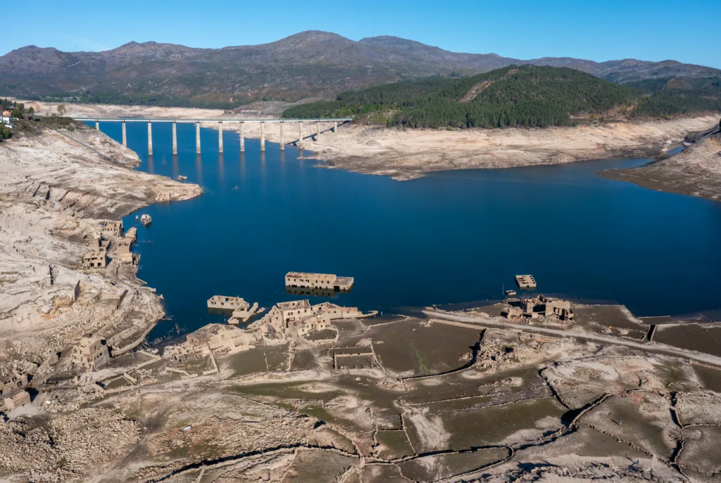 drone view of the ghost town of Aceredo in the Alto Lindoso reservoir with low water levels