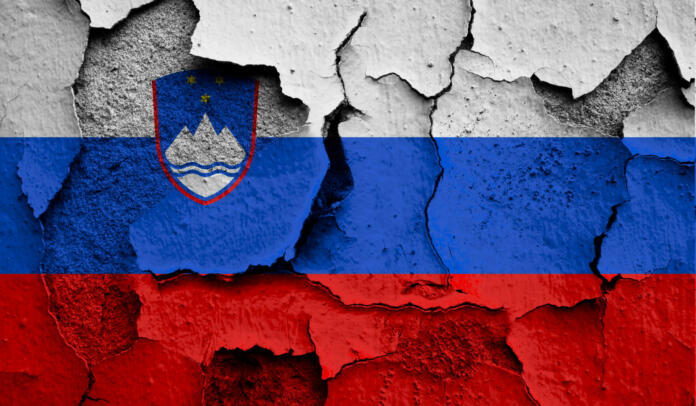 Flag of Slovenia on old grunge wall in background