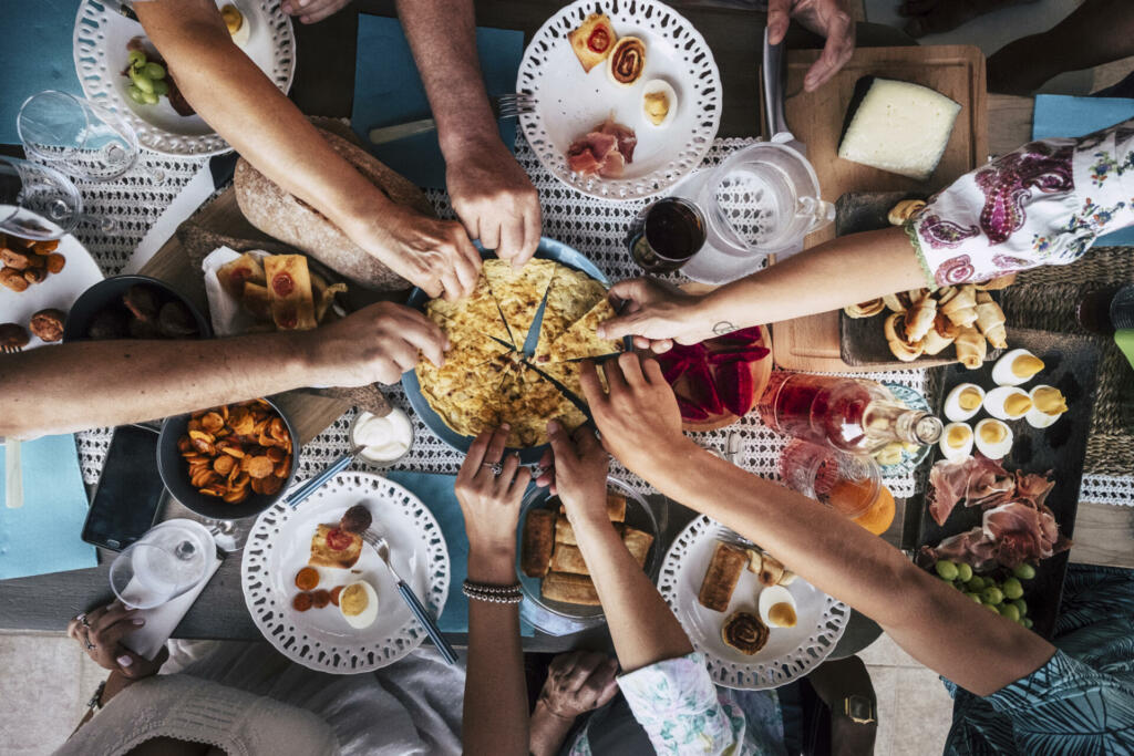 Food Catering Cuisine Culinary Gourmet Party Cheers Concept friendship and dinner together. mobile phones on the table, pattern and background colorful image with people eating and taking food during an event