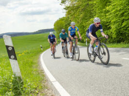 Frankfurt, Germany - May 7, 2022: group of bicycle sportsmen have a race in the beautiful Rheingau area in Germany.