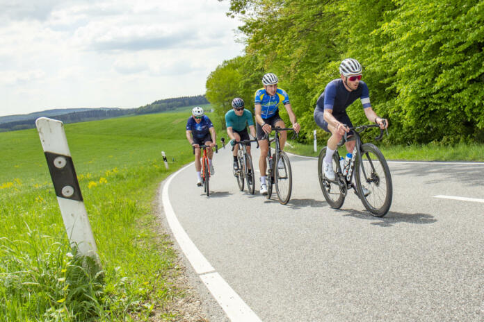 Frankfurt, Germany - May 7, 2022: group of bicycle sportsmen have a race in the beautiful Rheingau area in Germany.