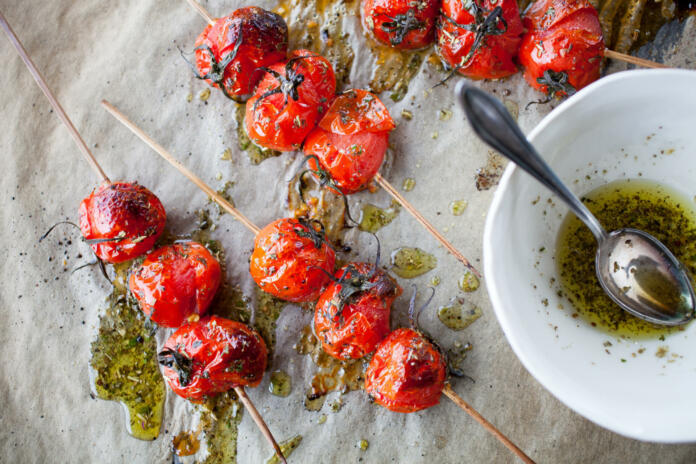 Grilled tomato skewers and toasted baguette