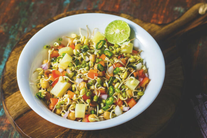 healthy sprout salad with mung bean sprout,chopped onion,tomato and boiled potato.