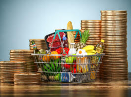 Inflation, growth of food sales or growth of market basket or consumer price index concept. Shopping basket with foods and coin stacks. 3d illustration